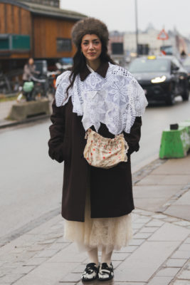 Woman wearing black and white outfit with cow print shoes