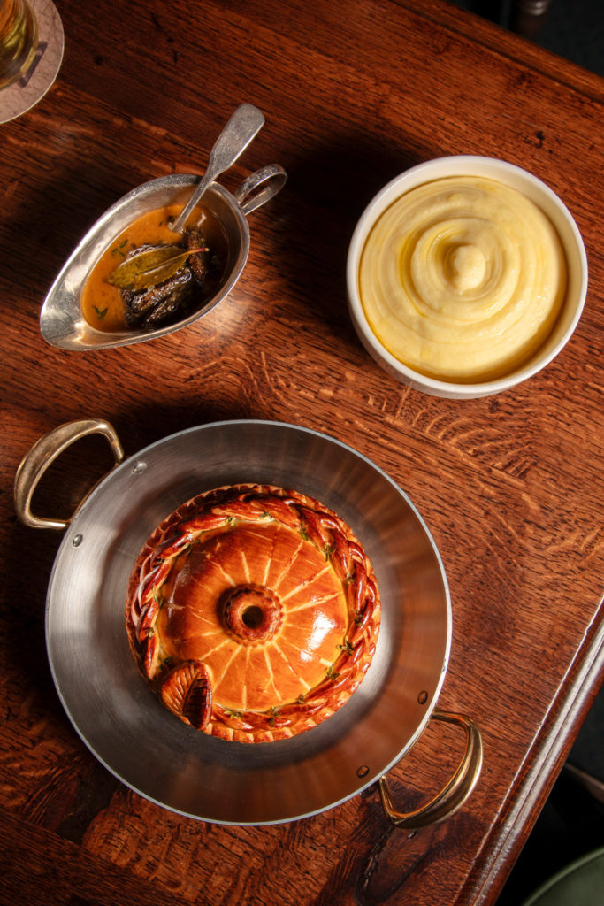 Pork pie on a wooden table