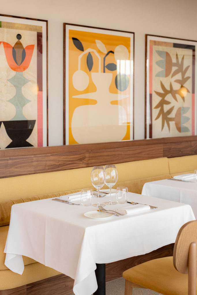 A table and wall art in Cornus