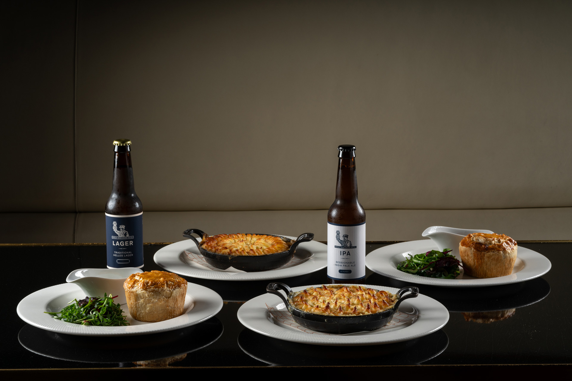 Pies and beers on a table