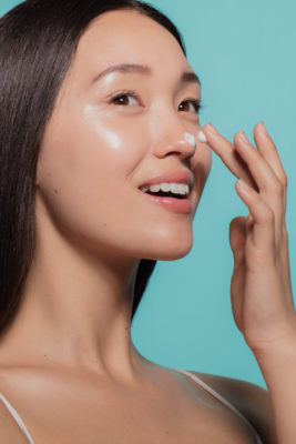 Woman practicing moisture sandwiching