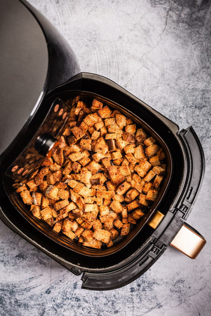 Croutons cooking in an air fryer