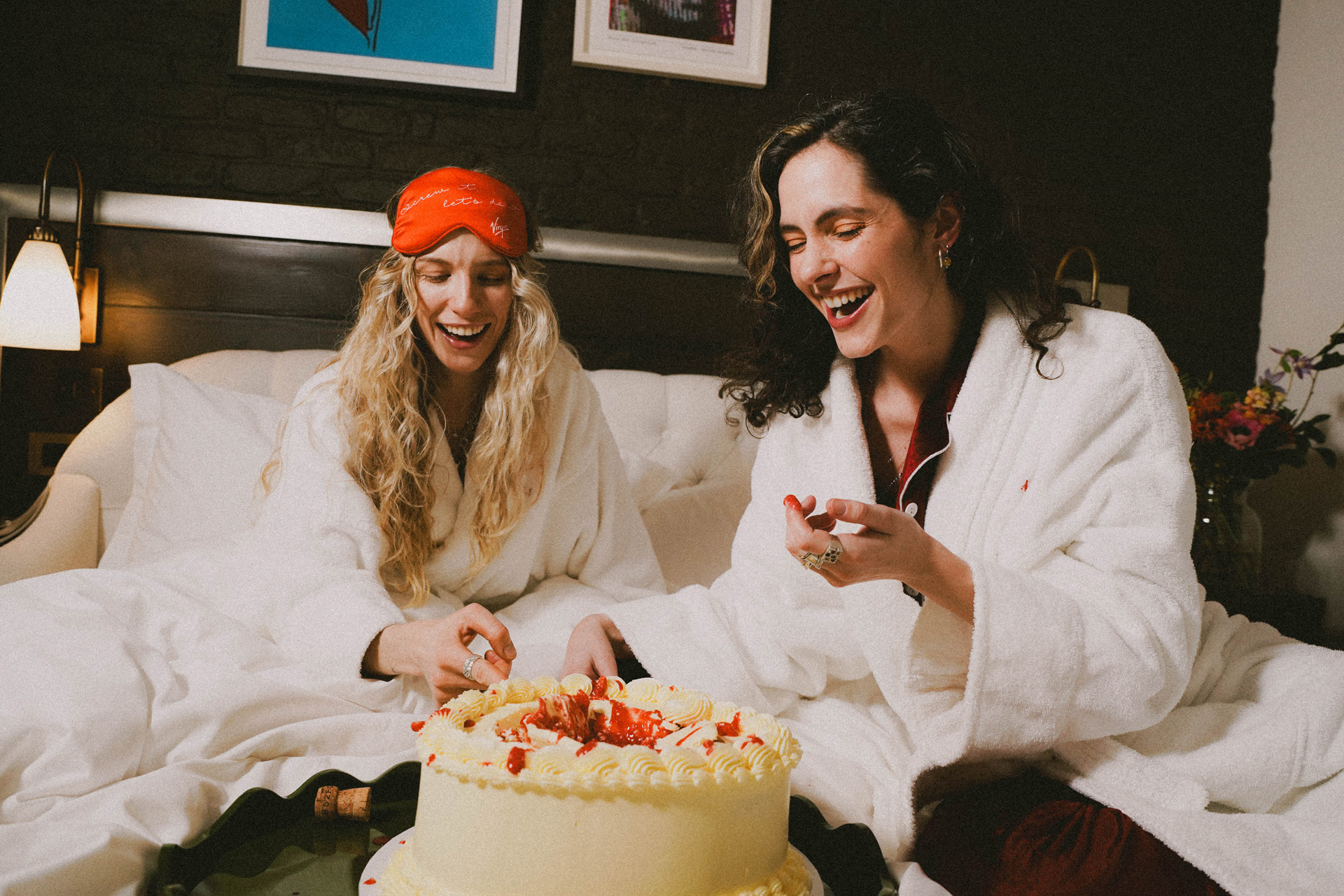 Two women sharing a cake