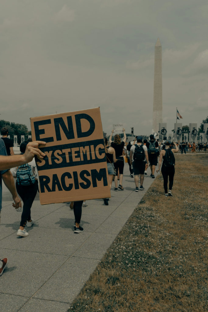People march towards the Washington Monument at the Black Lives Matter protest in Washington DC