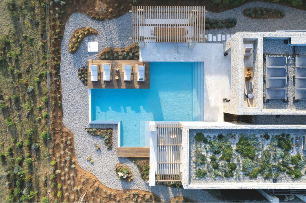 Aerial view of luxury bioclimatic villas with an outdoor pool, terrace and roof garden