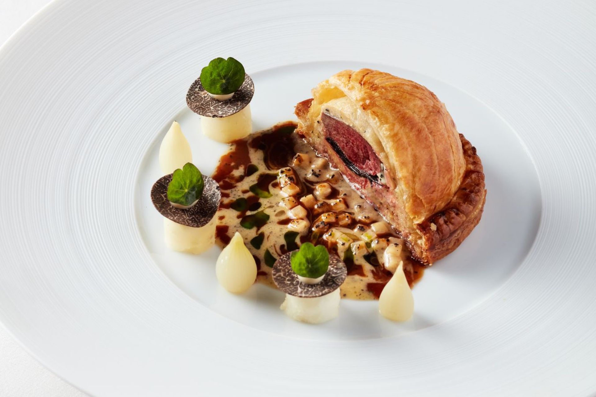 Pastry-covered pigeon dish