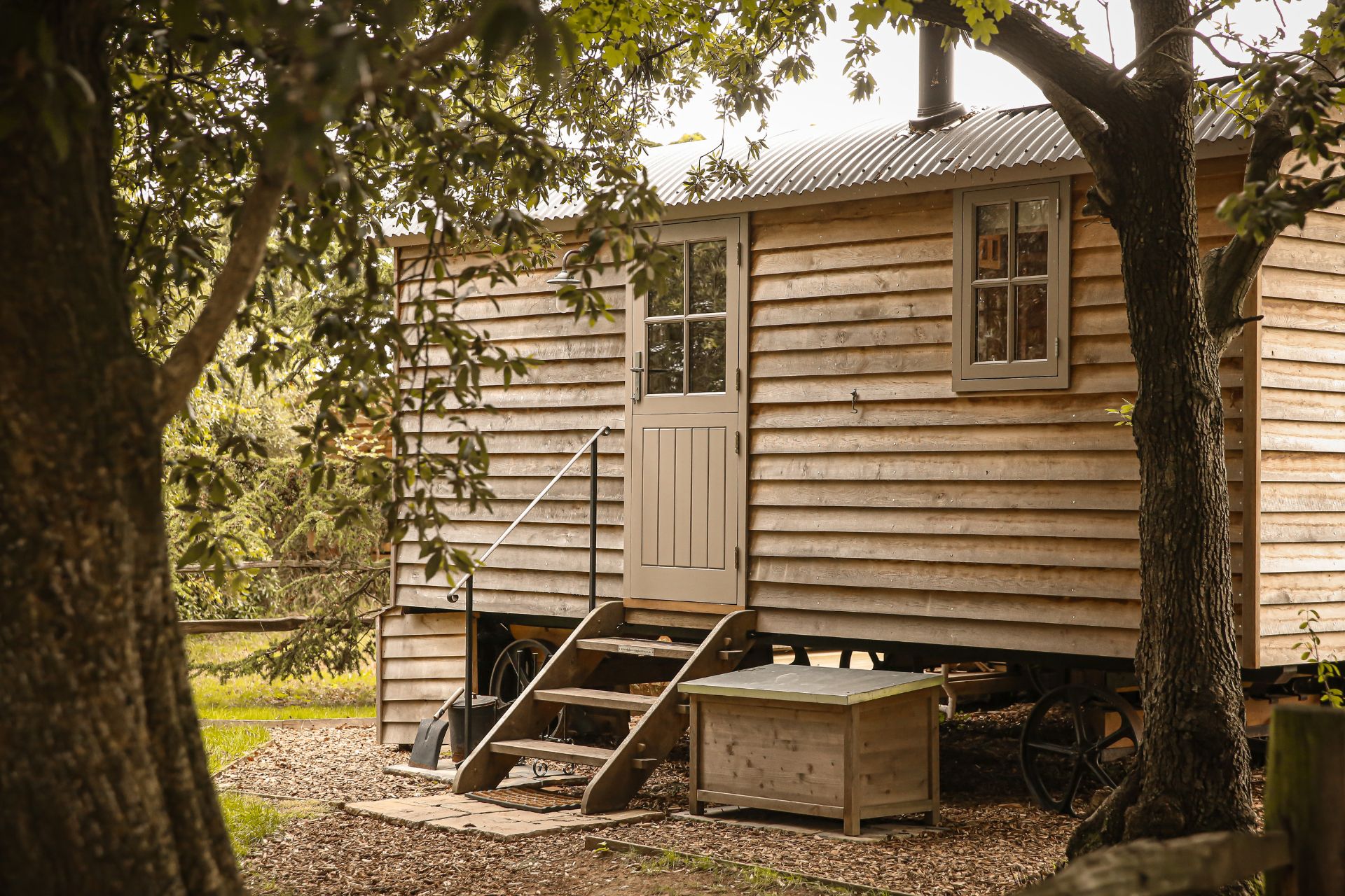 Shepherd's hut with a taupe wooden door
