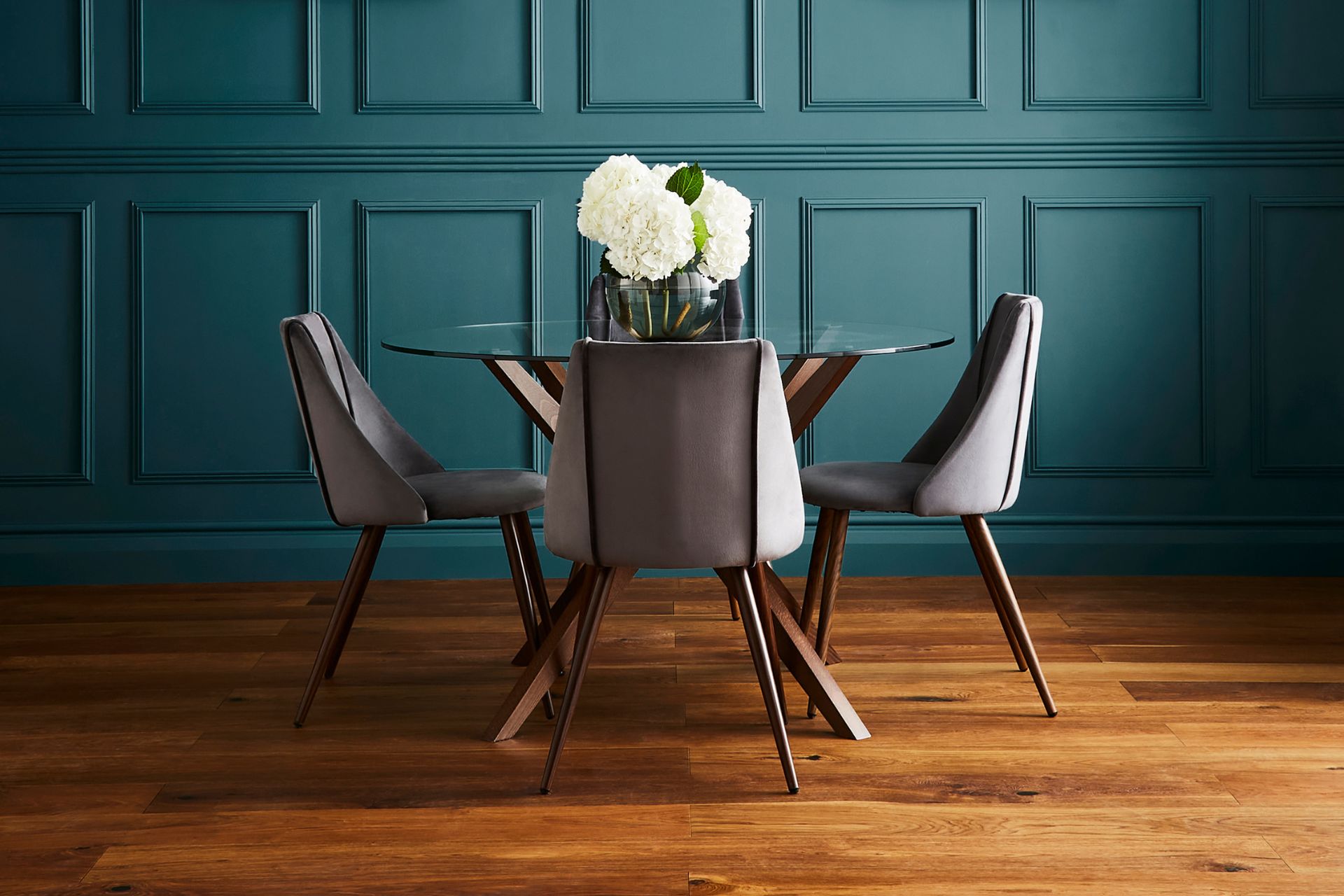 Teal dining room with wood panelling