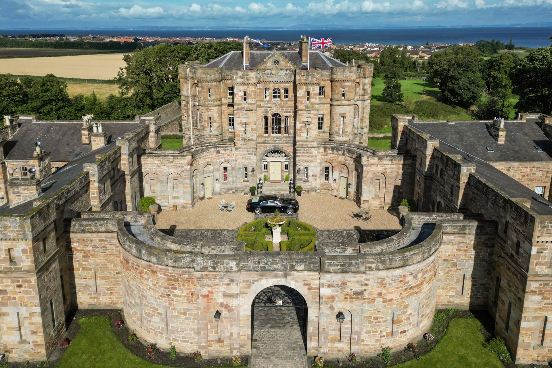 Aerial view of Seton Castle, a Neoclassical castle in Scotland