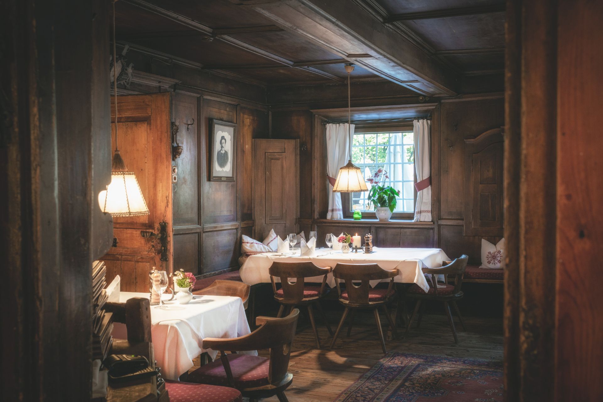 Wood-panelled dining room with mountain views