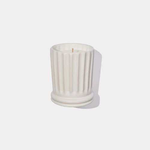 White candle with ceramic ridge design