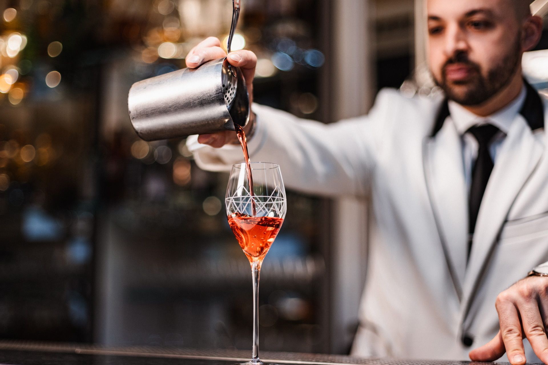 Bartender pouring a cocktail at The Savoy