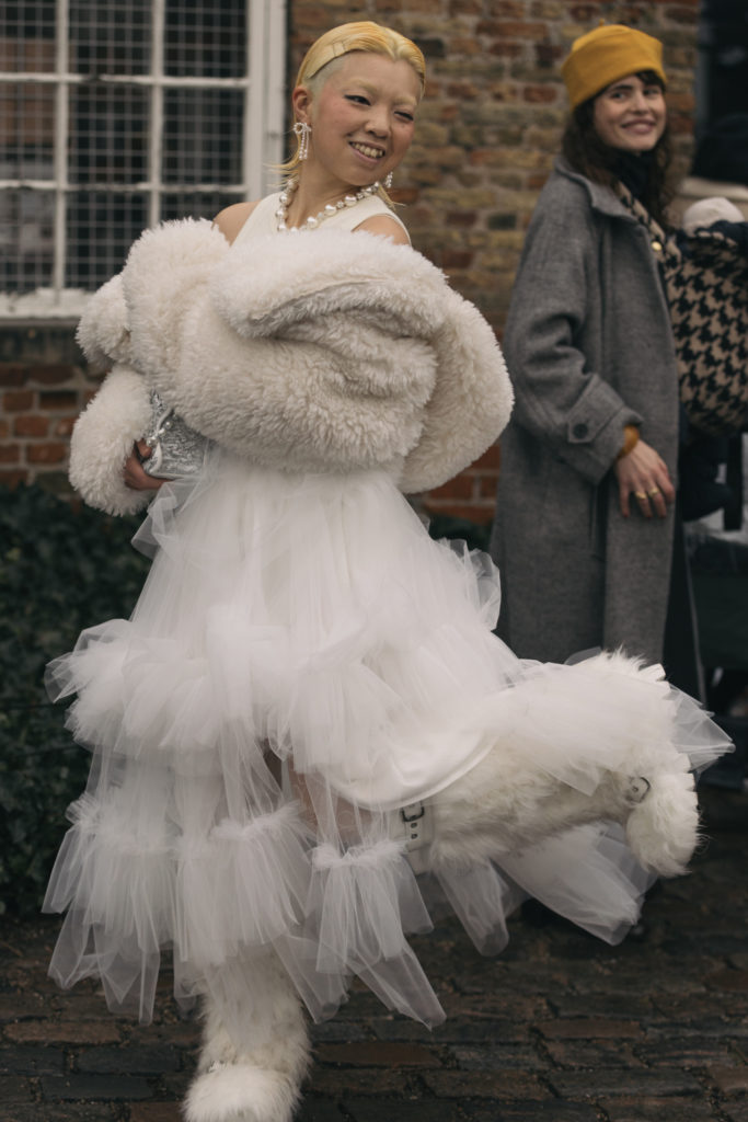 Woman with kicked bob wearing white dress