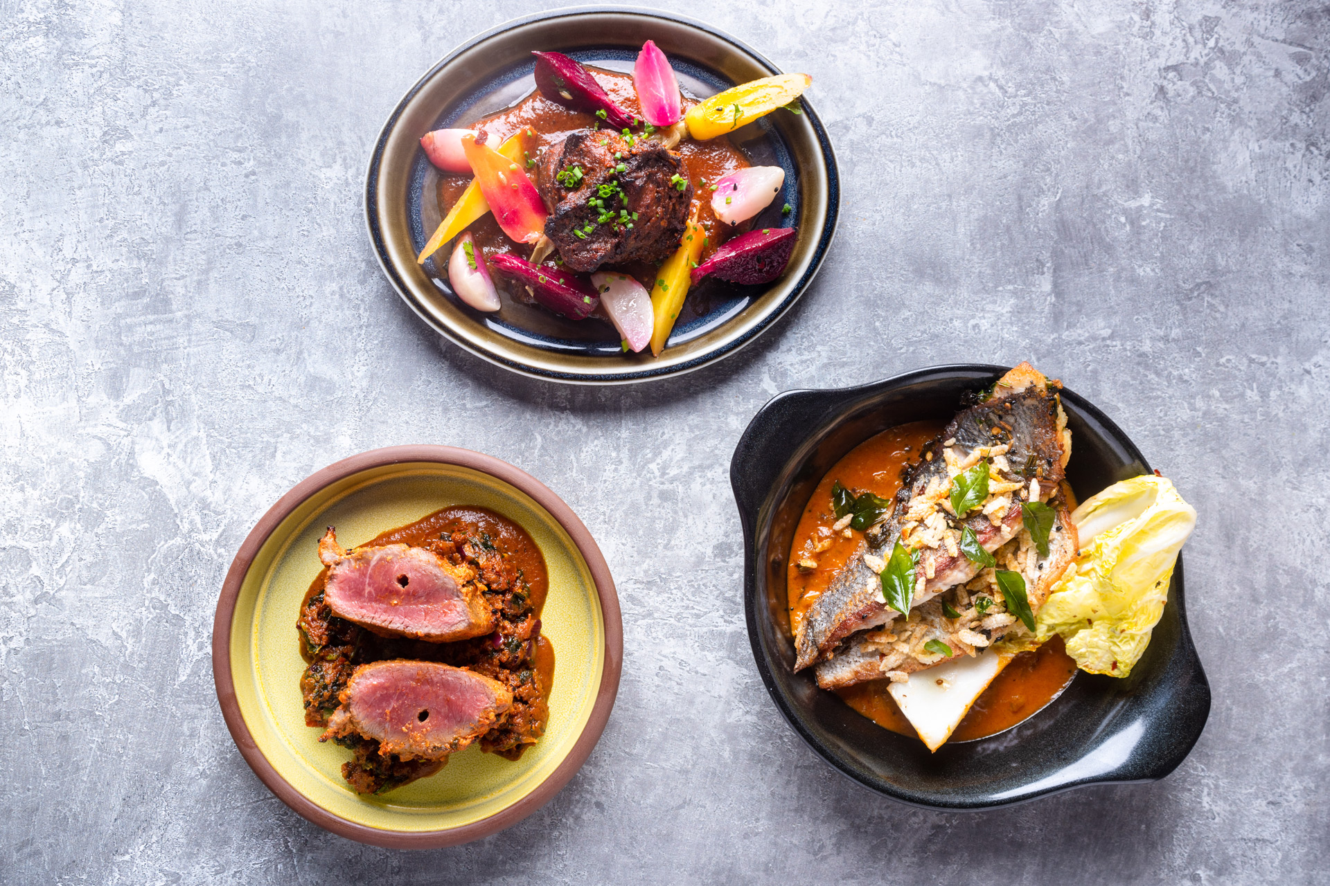 Plates of food at Cinnamon Kitchen restaurant