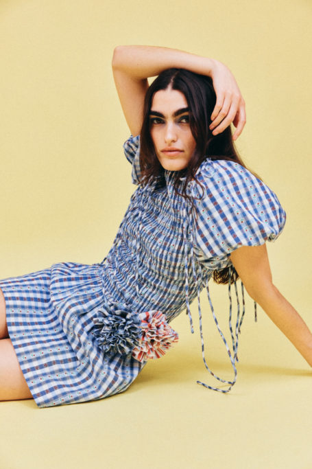Woman in gingham blue dress