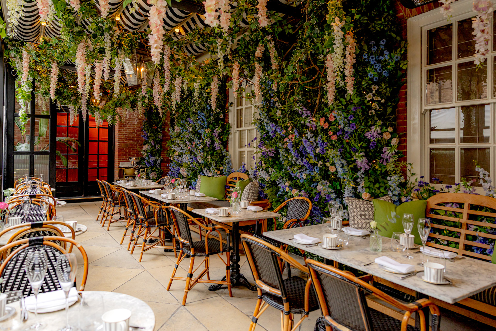 Al fresco dining terrace covered in flowers