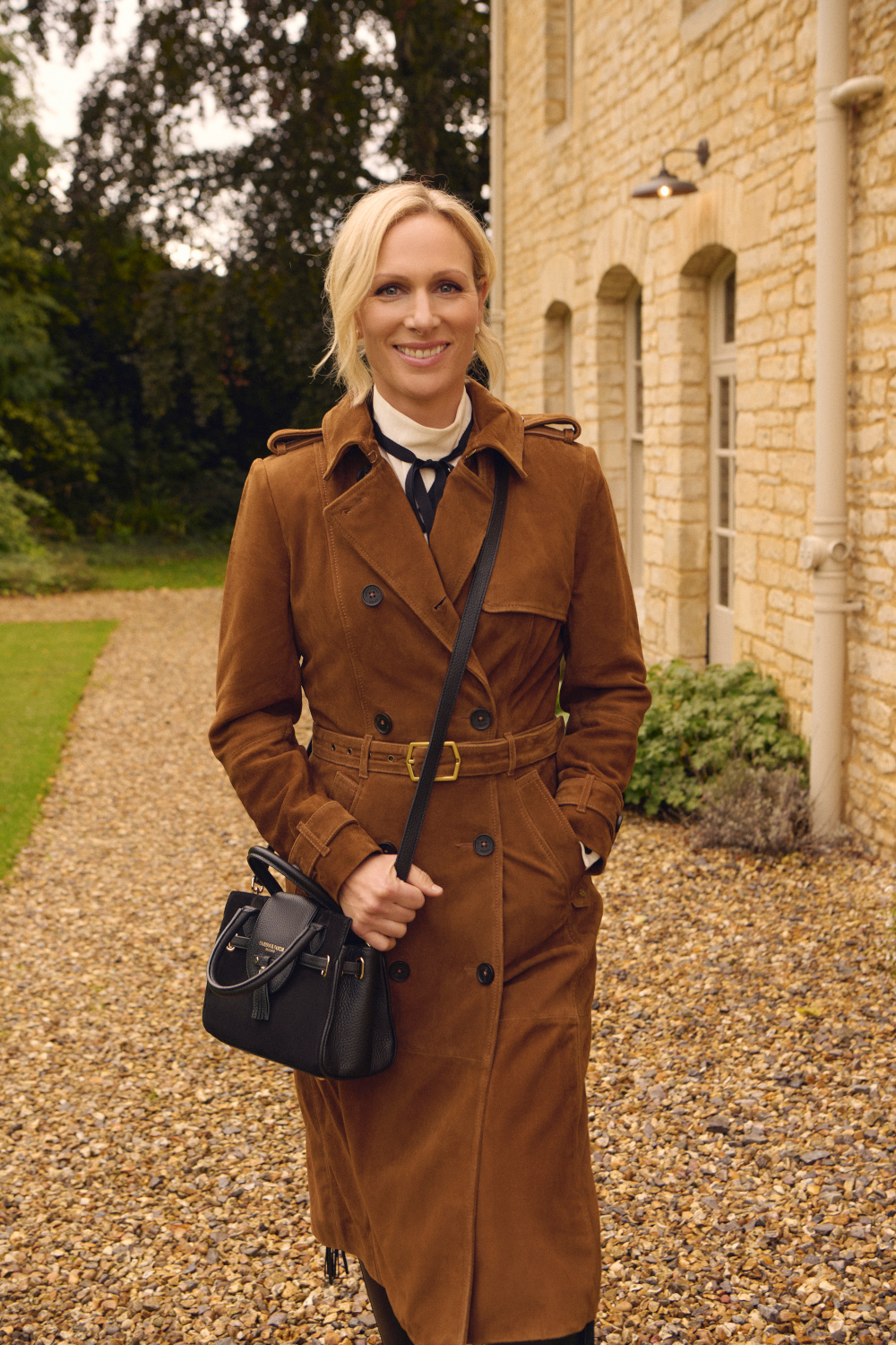 Woman in brown trenchcoat