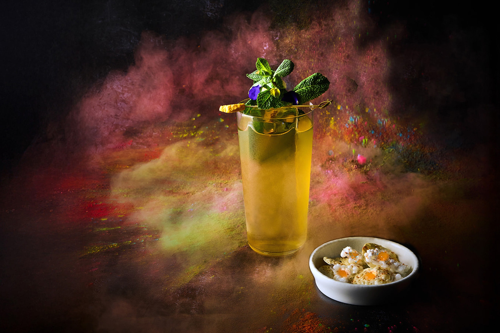 Yellow cocktail against a black background