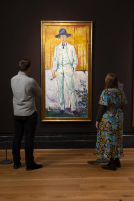 Visitors observe Portrait of the Painter Ludvig Karsten (1905) by Edvard Munch, displayed as part of the exhibition Edvard Munch: Portraits at the National Portrait Gallery