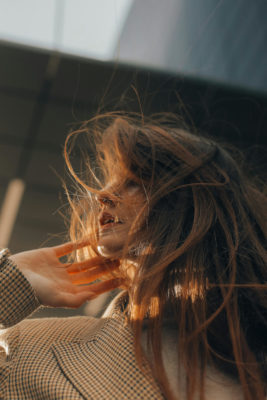 Woman with head turned away | hair cycles