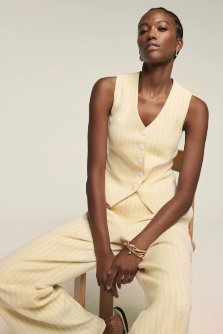 Woman in butter yellow suit