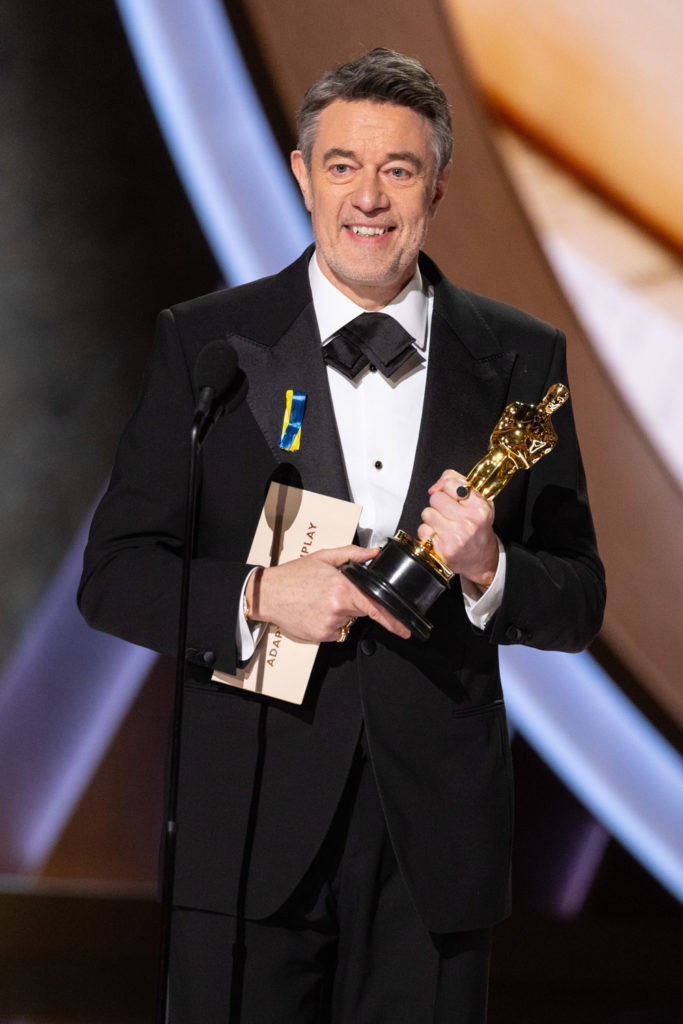 Peter Straughan accepts the Oscar® for Adapted Screenplay during the live ABC Telecast of the 97th Oscars® at the Dolby® Theatre at Ovation Hollywood on Sunday, March 2, 2025.