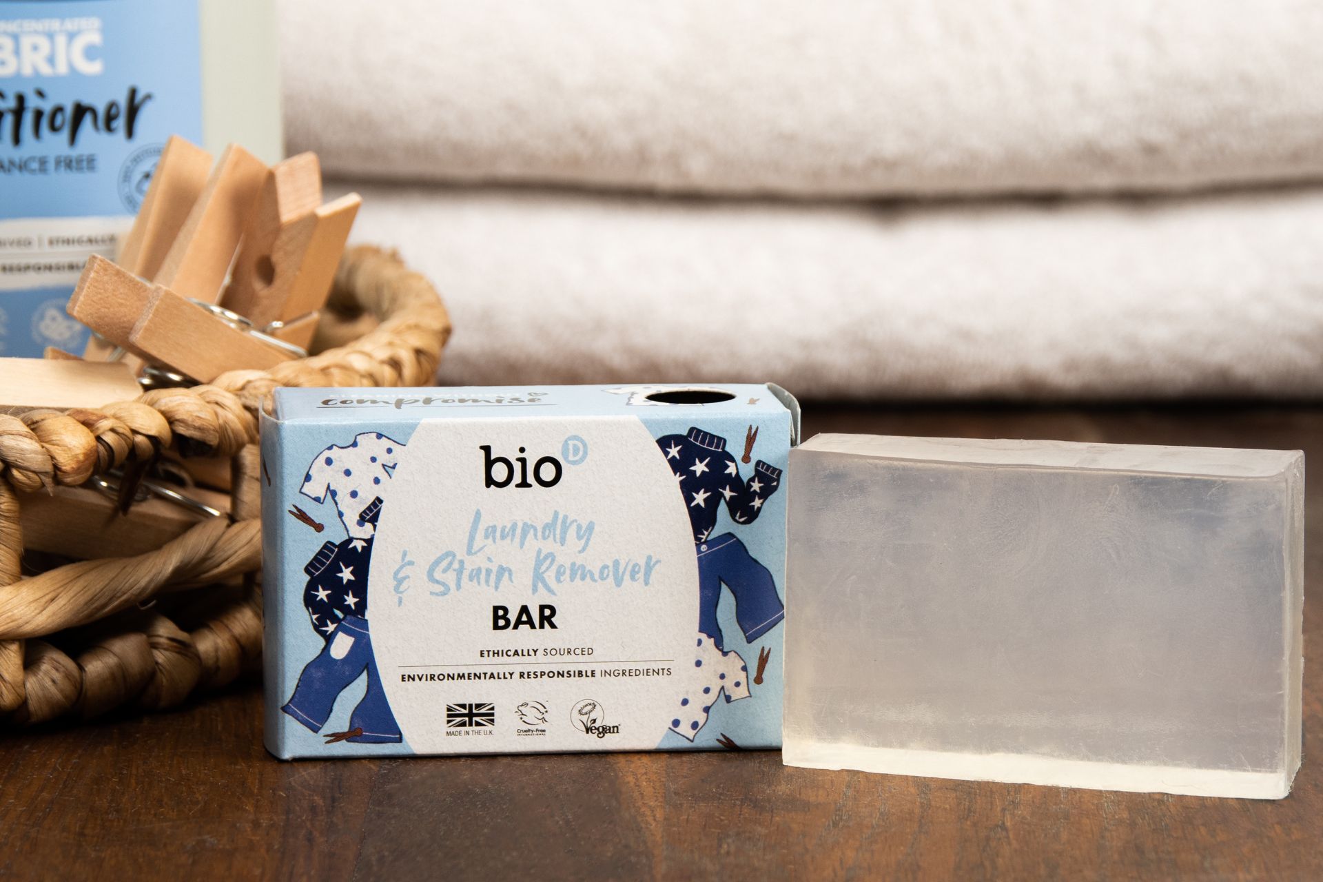 Bio-D stain remover bar with a set of white towels behind