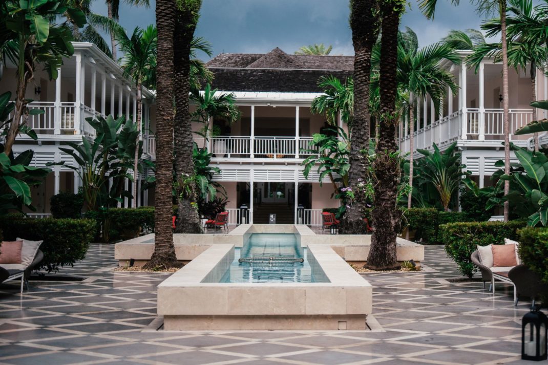 Bahamas resort with tiled courtyard, central water feature and palm trees