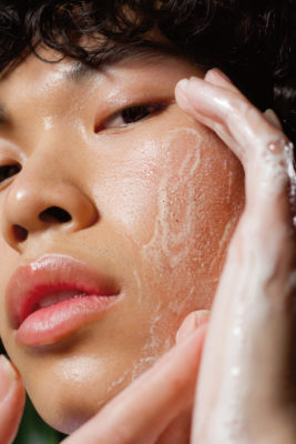 Man applying skincare | k beauty men