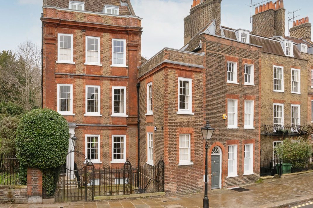 Red brick Georgian townhouse with garden beside