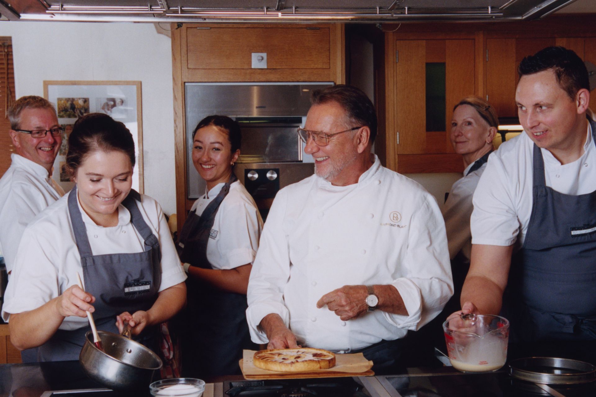 Le Manoir's chefs in the kitchen, with Raymond Blanc in the centre