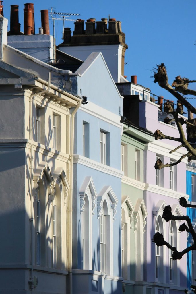 Pastel-coloured townhouses in Notting Hill