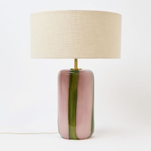 Cream lampshade with a pink and green striped glass base