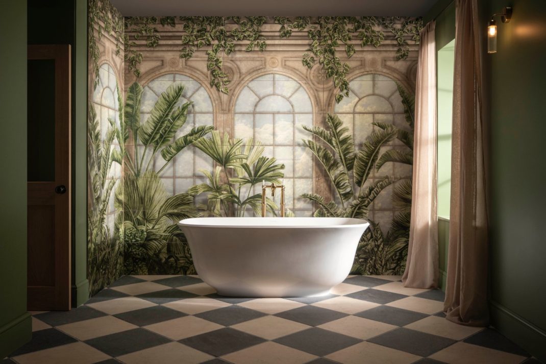 Bathroom with taupe and black diamond tile flooring and a feature wall with a botanical mural, alongside a freestanding bathtub.