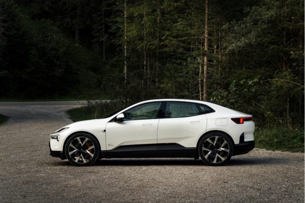 Sleek white EV parked in an Austrian forest