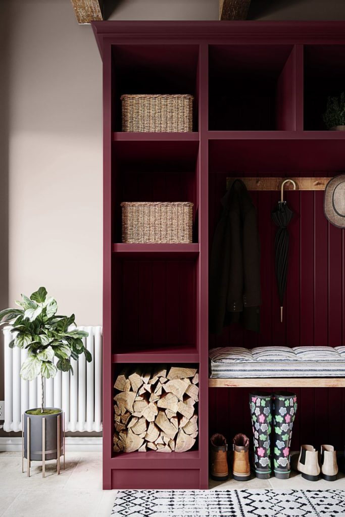 Boot room with red built-in shelving and white walls