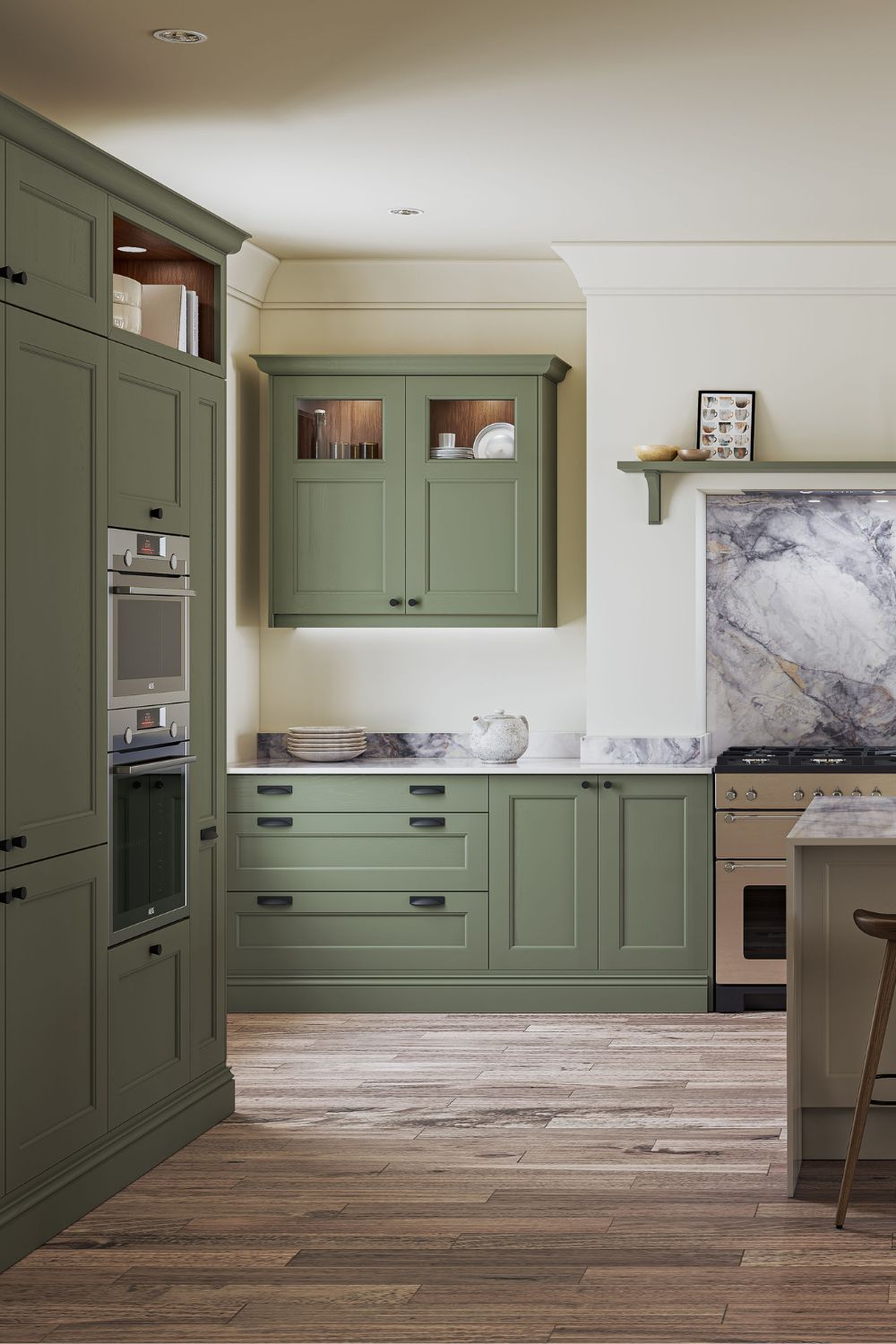 Kitchen with pistachio green Shaker cabinets and a white marble backsplash