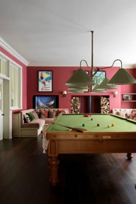 Games room with snooker table, corner banquette seat and dusty pink feature wall