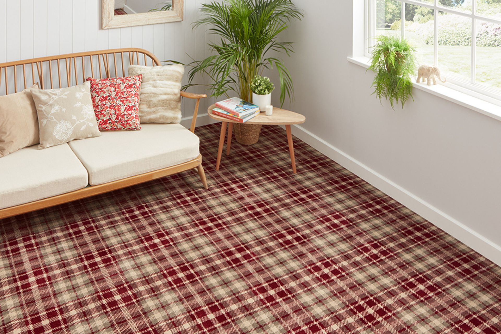 Living room with cream sofa, wooden corner table and red plaid carpet