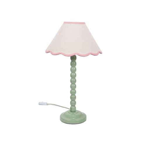 Table lamp with green bobbin base and scalloped pink shade