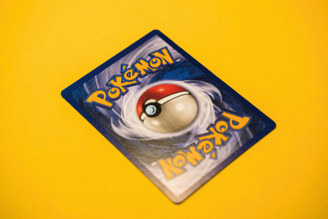 Pokemon card against a yellow background