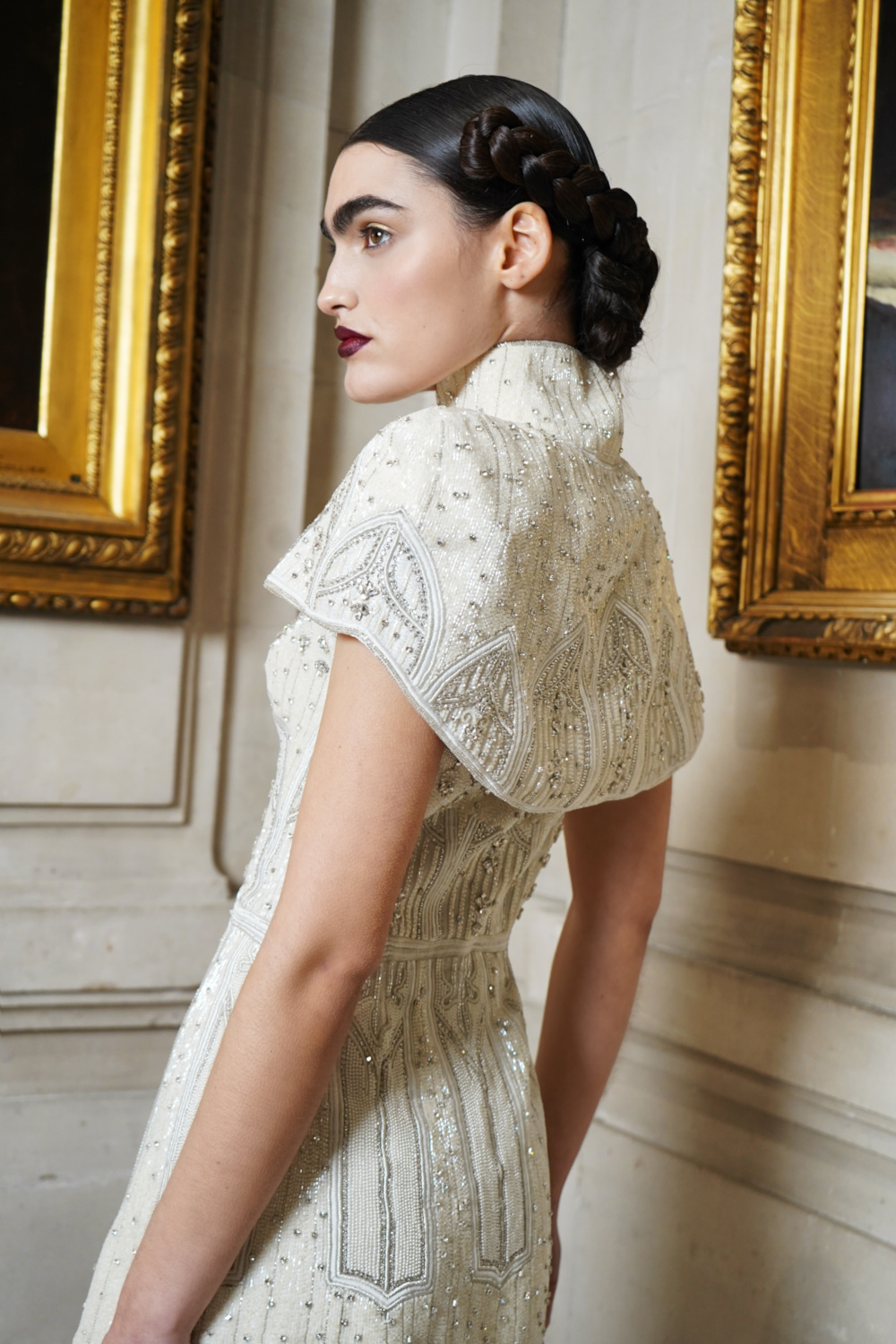 Close up of woman in white dress and bolero