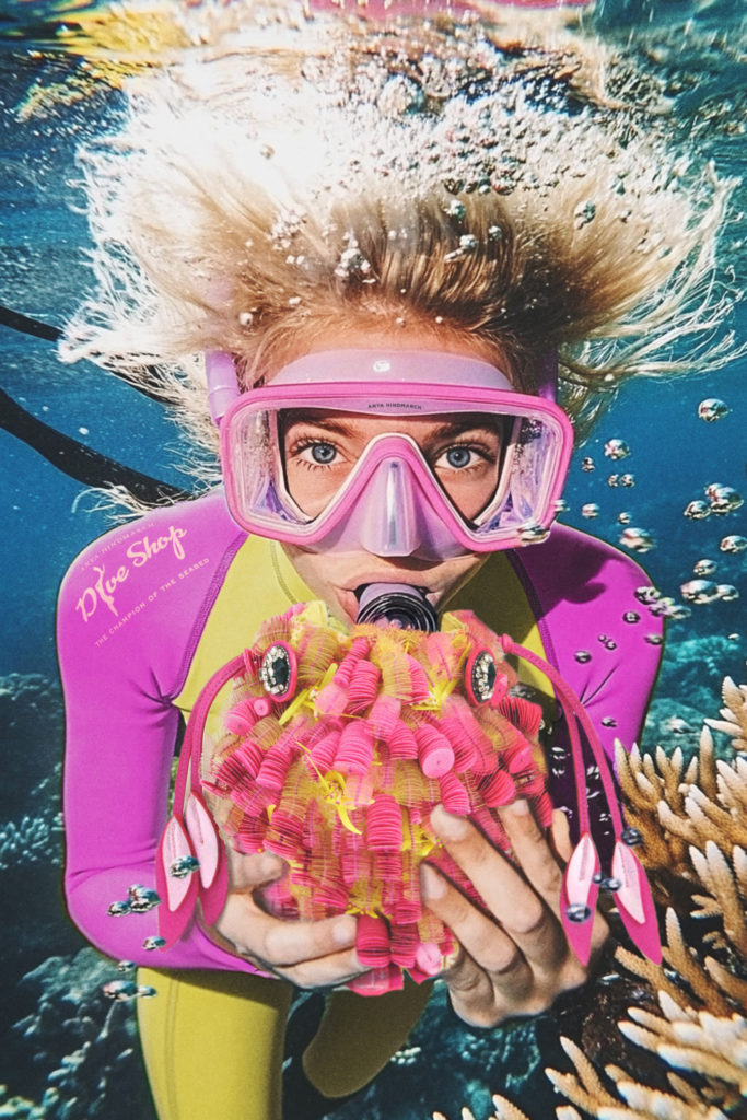 Woman diving with bag