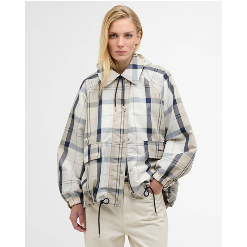 A woman wearing a checked waterproof jacket