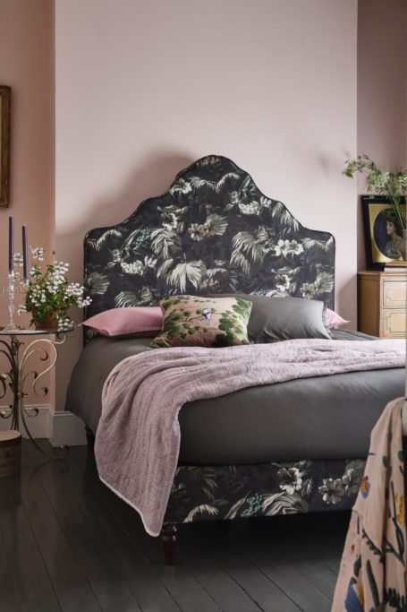 Bed with blue headboard