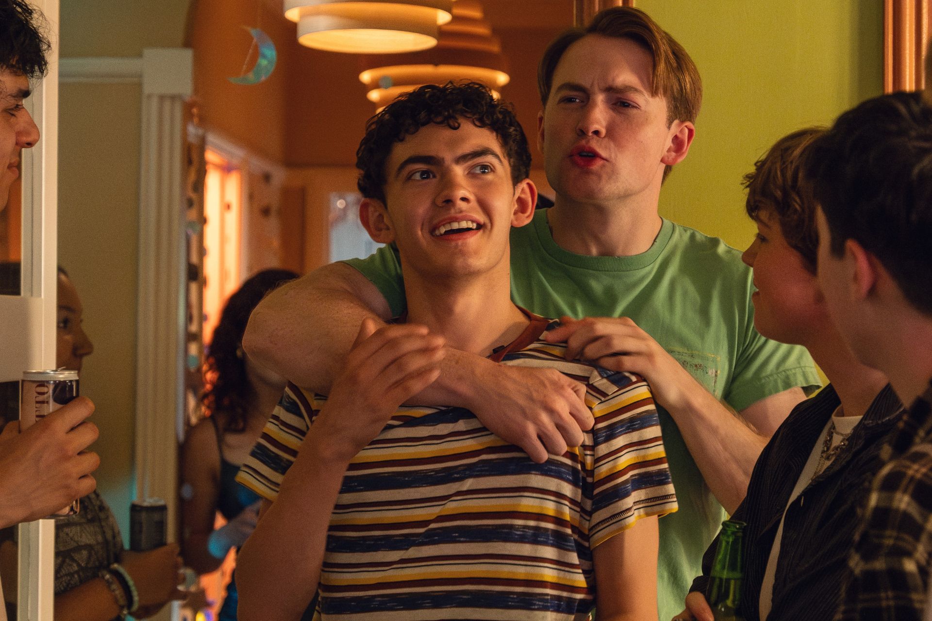 Nick hugging Charlie from behind in Heartstopper Forever
