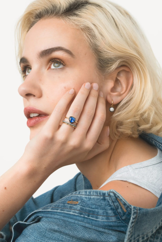 Woman wearing coloured engagement ring