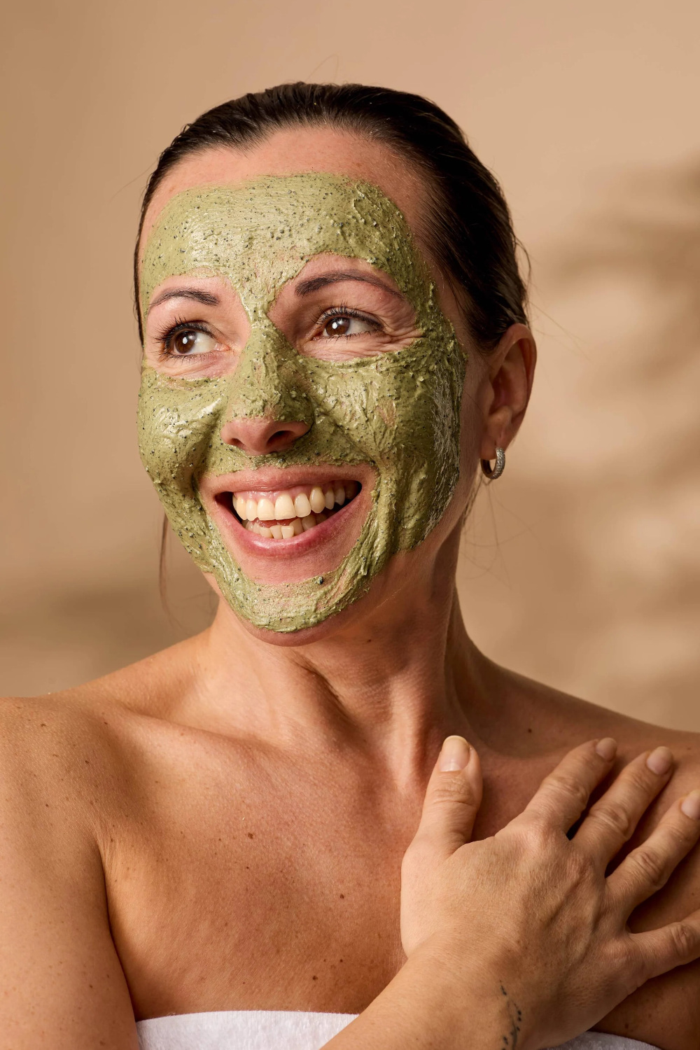 Woman wearing matcha face mask
