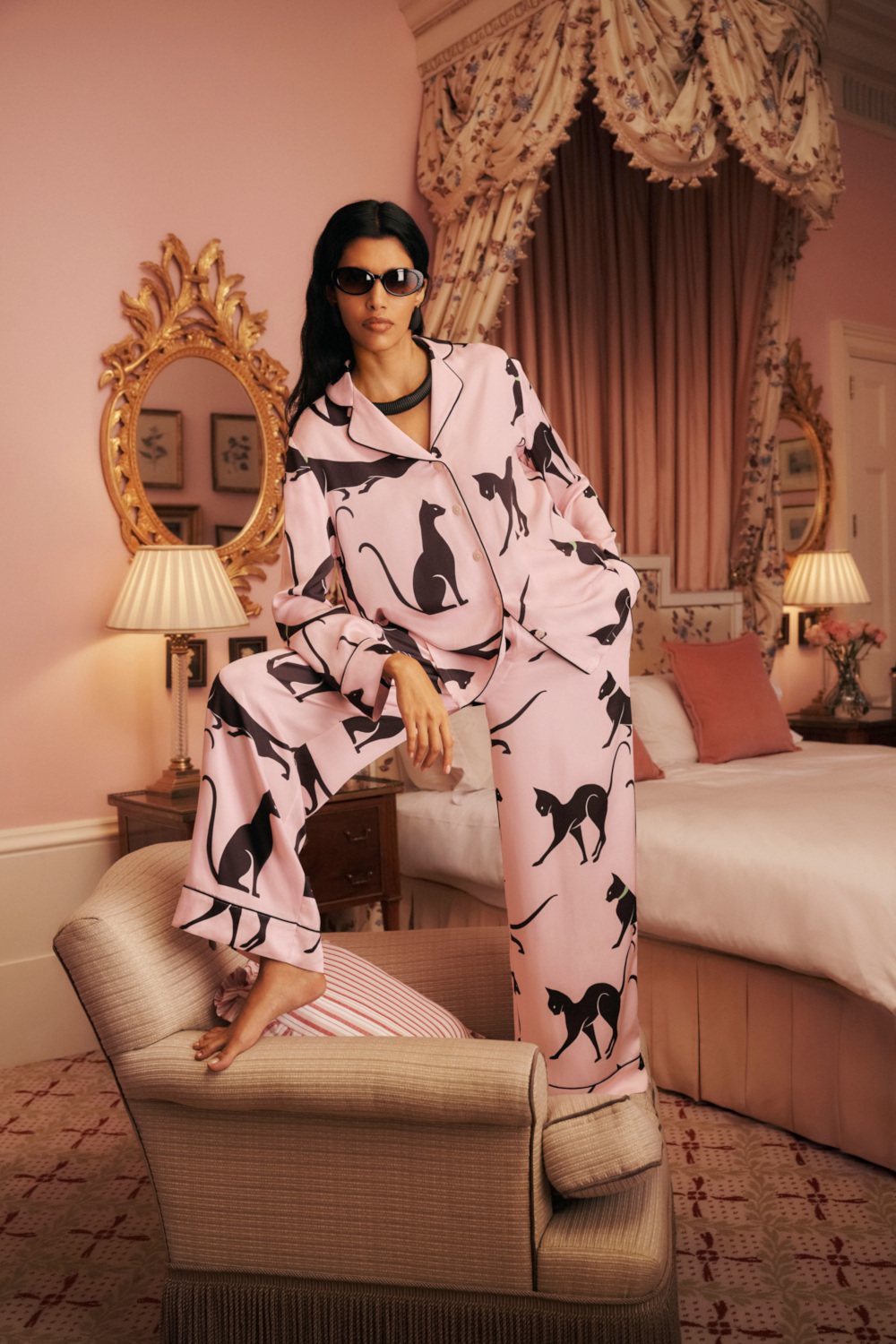 Model wearing pink cat M&S x Olivia von Halle PJs