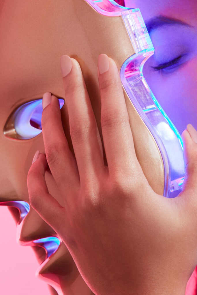 Woman using skincare device